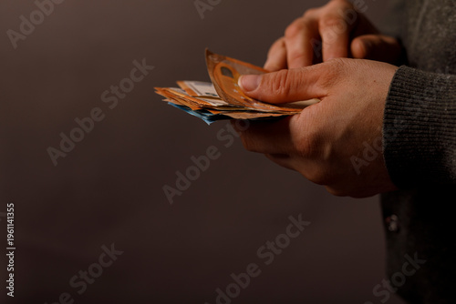Close-up of hands counting ...