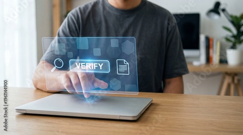 Person using holographic verification interface above a laptop AI Human Oversight concept