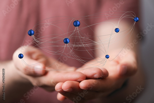Close-up of hands holding a...
