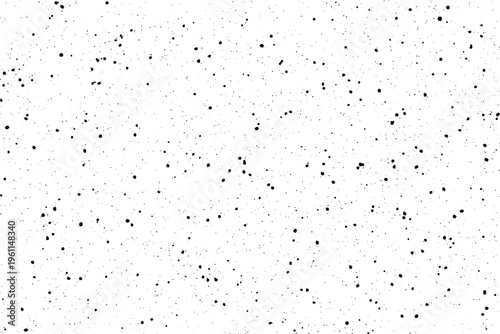 A fine grain effect with black granules and small spots spread unevenly over a stark white area