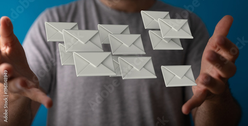Man holding floating envelo...