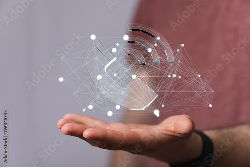 Abstract image of a hand holding a digital network or futuristic concept. Connection, communication, and technological a