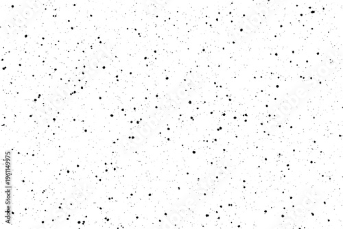 A simple composition of tiny black spots randomly dispersed across a clear white canvas