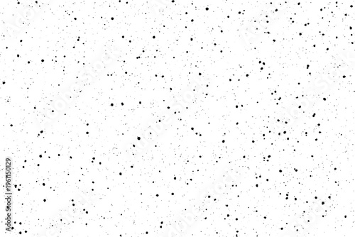 A stark visual displays many small black particles dispersed unevenly across a clear white backdrop