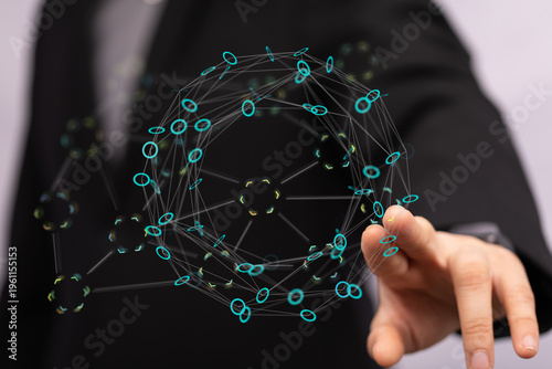 Close-up of a hand interacting with a glowing network sphere representing technology, connections, and data transfer. Il