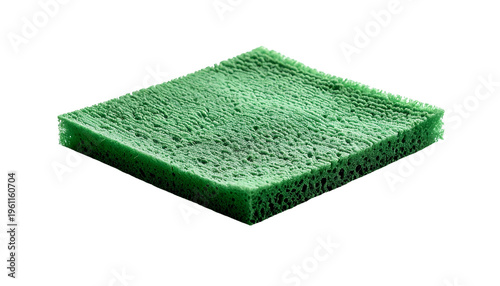 A square, green sponge floats against a black background, showing porous texture