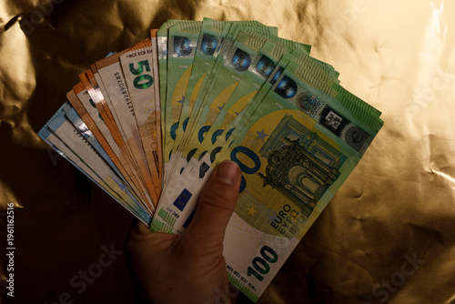 Hand holding euro banknotes...