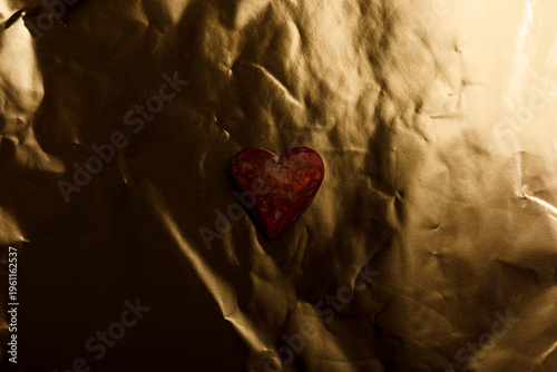Heart symbol on a shiny gol...