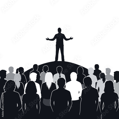 Man standing on hill addressing crowd.