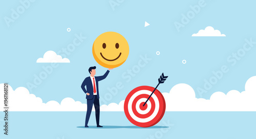 Professional businessman holding a giant yellow smiley face next to a target bullseye to represent customer satisfaction and goals.