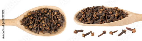dry spice cloves in wooden spoon isolated on white background. Top view. Flat lay