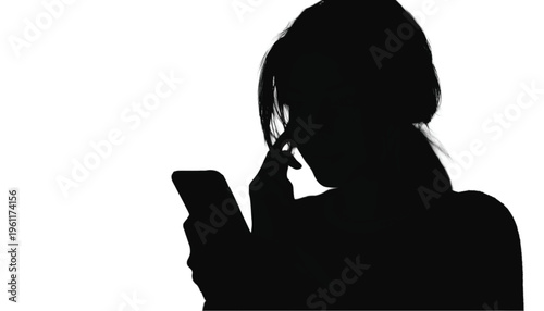 Anonymity suggested by a dark silhouette holding a small mobile phone near the face thoughtfully.