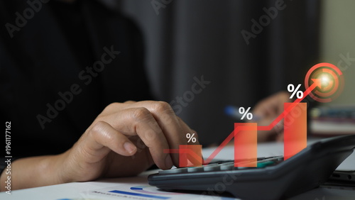 Business growth and financial success concept with hand using calculator 