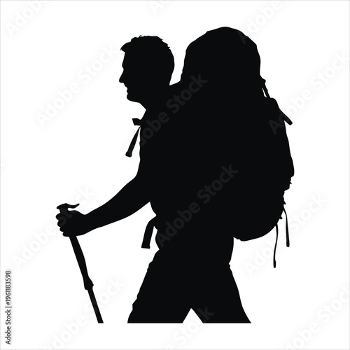 A silhouette of a man hiking with a backpack and trekking pole