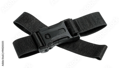 Black nylon luggage strap with a plastic buckle, crisscrossed, isolated on black