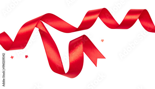 A flowing, vibrant red satin ribbon, with varying folds and light play against a black backdrop