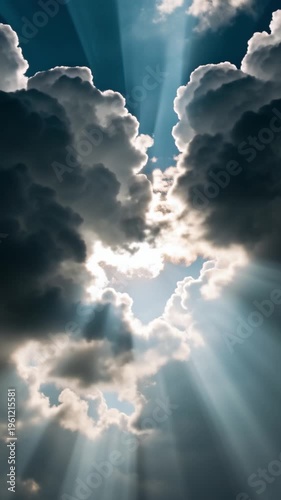 Sunlight glistens through the clouds, creating a ray of hope, presence of a higher power