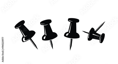 Four black push pins in various angles a striking silhouette