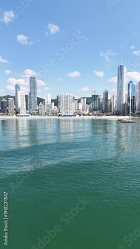 Beach, Ocean and City Skyline Surrounded by Nature