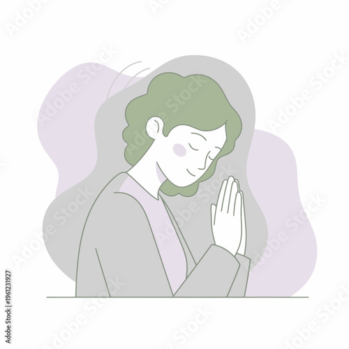 Woman praying with closed eyes and hands together.