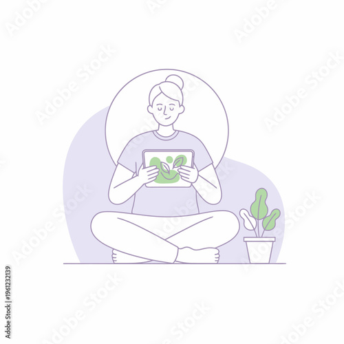 Woman sitting cross-legged holding a tablet device.