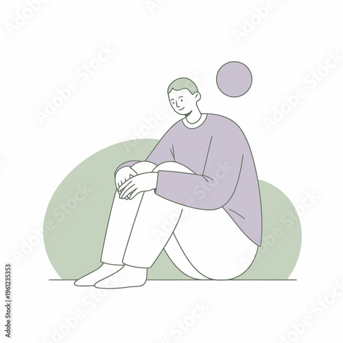 Young man sitting alone in contemplation.