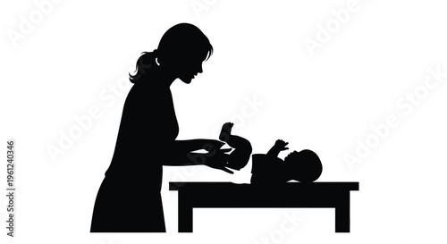 Mother gently tending to her baby on a changing table silhouette