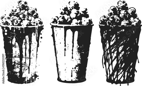 Popcorn cups with dripping sauce three containers filled with popcorn and various sauces dripping down sides