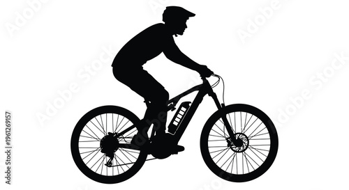 Cyclist riding an electric mountain bike a striking black silhouette