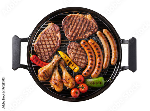 Fotografie Isolated delicious grilled meat and vegetables assortment on a portable barbecue
