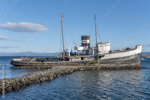 Schilderij op canvas historical tug boat run ashore as monument,  Ushuaia, Argentina