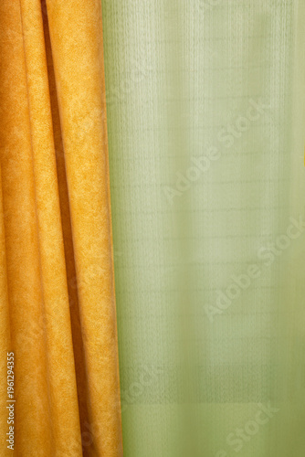 Vertical golden curtain background with side fabric and clean copy space