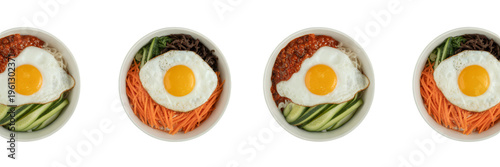 Four bowls of korean bibimbap with fried egg and mixed vegetables korean cuisine isolated on a transparent background