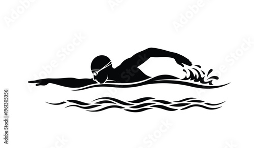 Silhouette of a person swimming in a pool with a cap on diving through the water with arms outstretched in a streamlined position