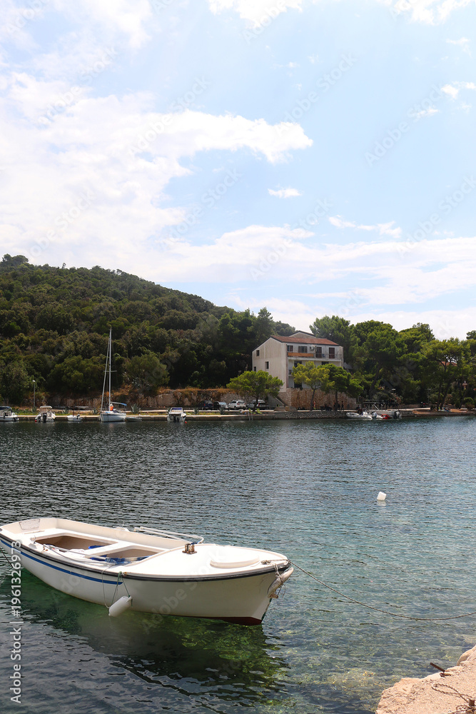 Fototapeta premium Small boat is moored in idyllic bay on island Lastovo, Croatia.
