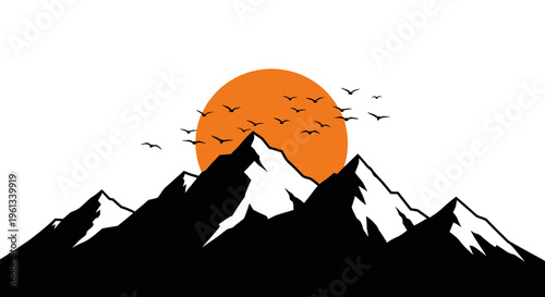 Mountain silhouette at sunset with birds flying orange sun behind snow capped peaks