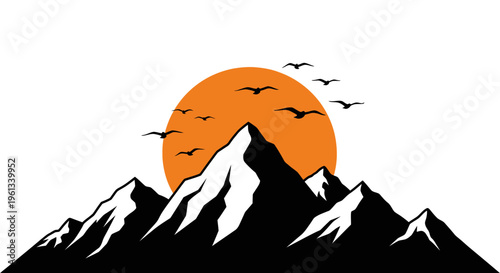 Silhouette of mountains with birds flying in front of sunset