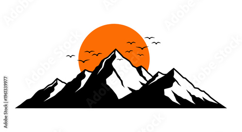 Vibrant orange sunset silhouette of mountains with birds in flight