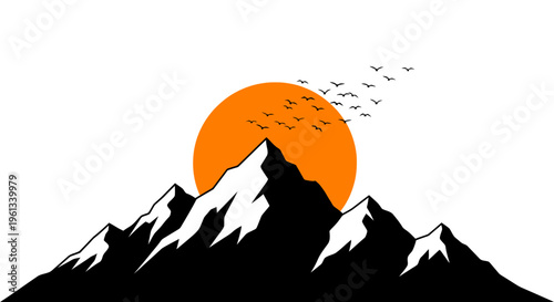 Mountain silhouette at sunset with birds flying against vibrant orange sky