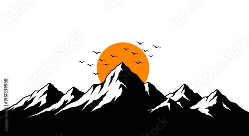 Vibrant orange sunset silhouette over snow capped mountains with flying birds