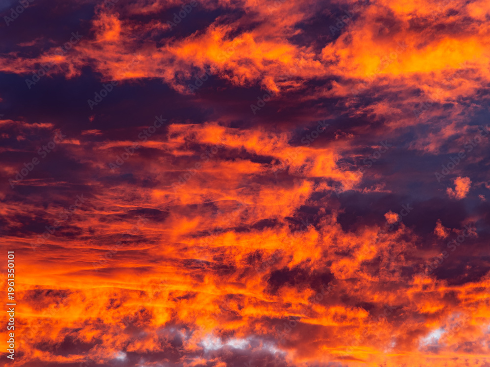 Fototapeta premium Burning sunset sky with fiery orange clouds