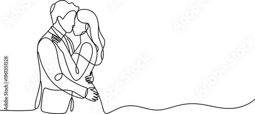 Couple embracing while kneeling by a body of water at sunset