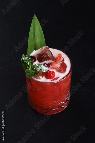 Alcoholic cocktail on a black background