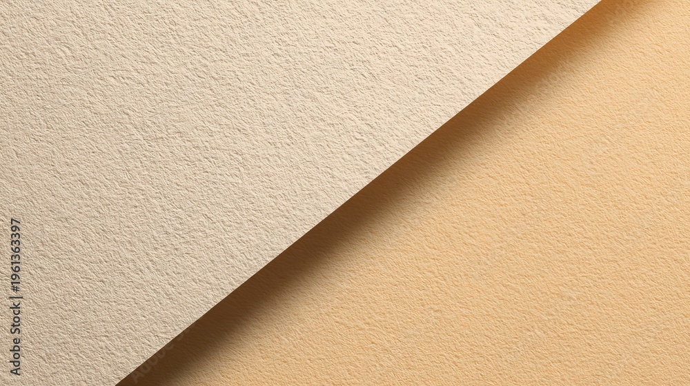 Fototapeta premium Textured beige and tan paper background with diagonal division