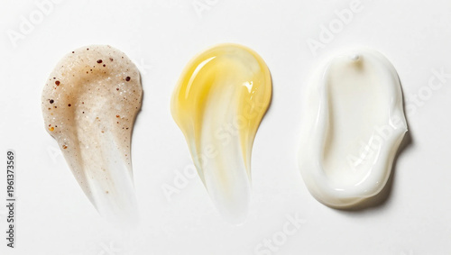 Three Cosmetic Product Smears – Scrub, Gel, and Cream on White Background