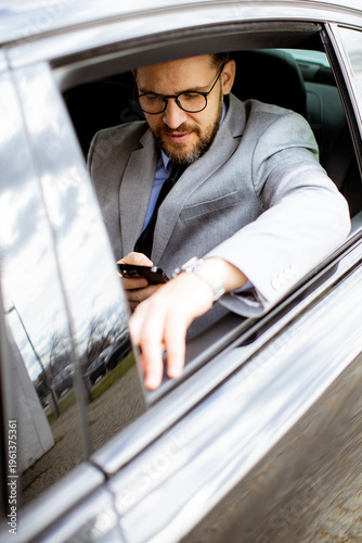 Businessman checking phone ...