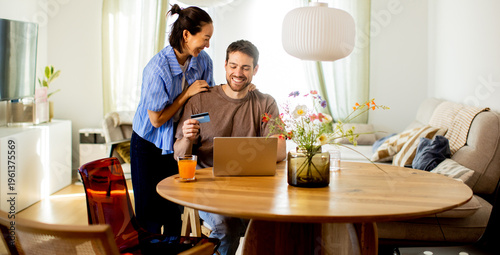 Couple shopping online at h...