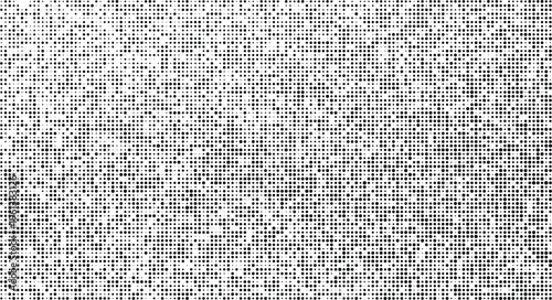 Abstract halftone dot pattern with random black and gray dots on a uniform background, full frame texture.