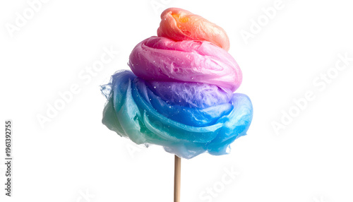 Rainbow swirl treat on a stick against a black background