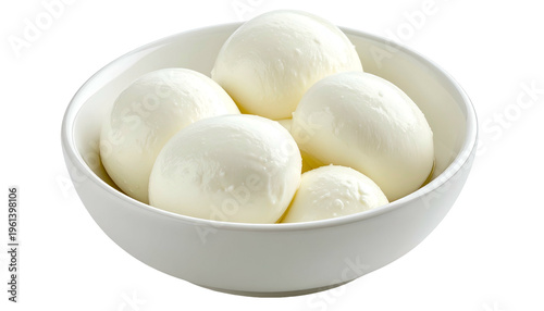 A white bowl filled with plump, milky-white, round cheese balls, close-up with soft lighting